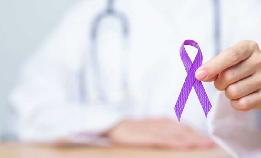 Doctor holding purple Ribbon for Violence, Pancreatic, Esophageal, Testicular cancer, Alzheimer, epilepsy, lupus, Sarcoidosis and Fibromyalgia. Awareness month and World cancer day concept